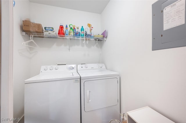 washroom with electric panel and independent washer and dryer