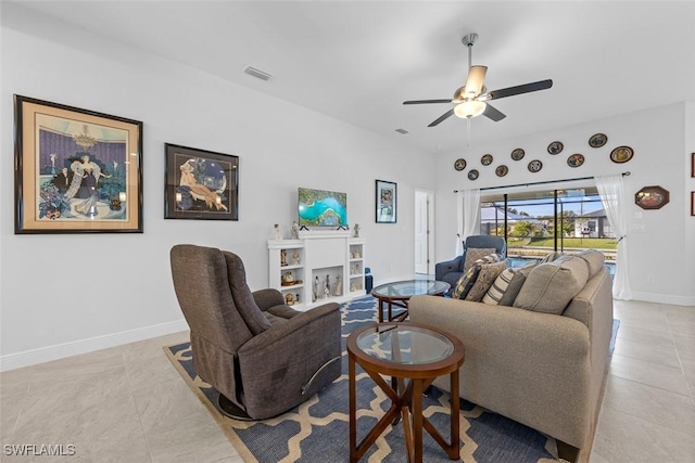 tiled living room with ceiling fan