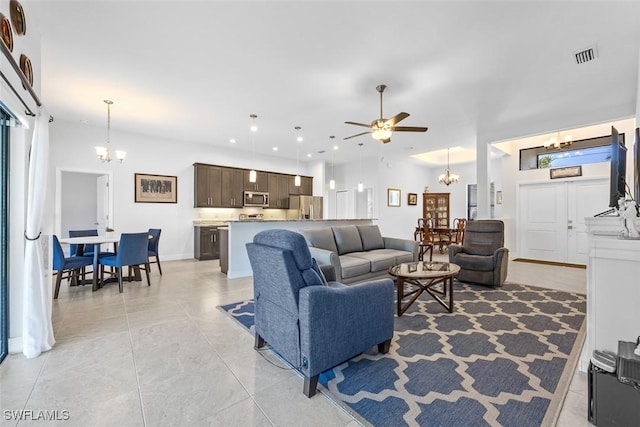 living room featuring ceiling fan and light tile patterned floors