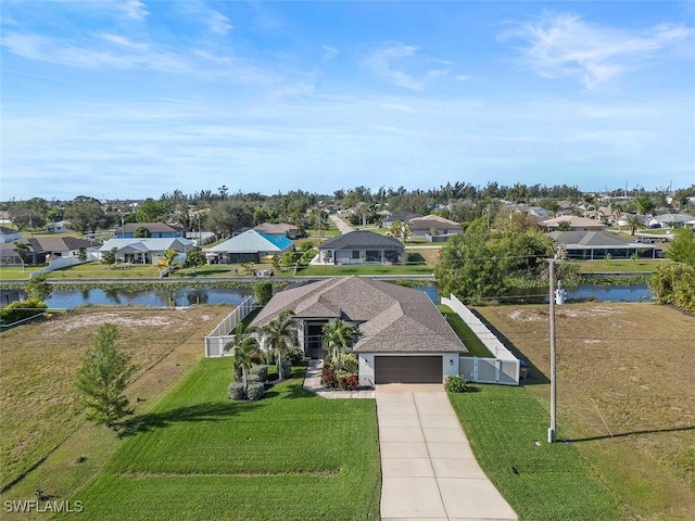 aerial view with a residential view and a water view