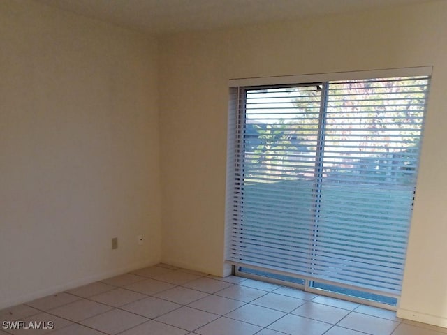 empty room with light tile patterned floors