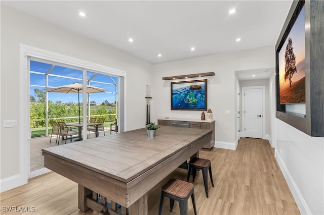 dining space featuring light wood-type flooring