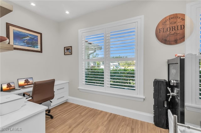 office space with light hardwood / wood-style flooring