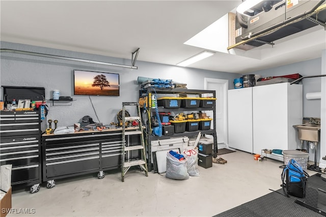 garage with a workshop area and sink