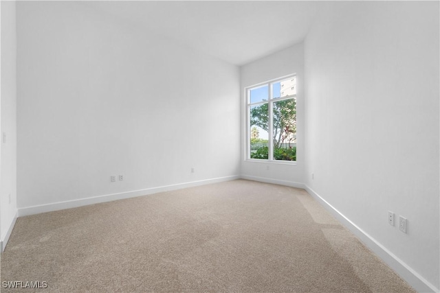 empty room featuring light colored carpet