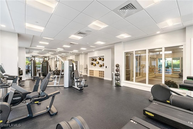 workout area featuring a paneled ceiling