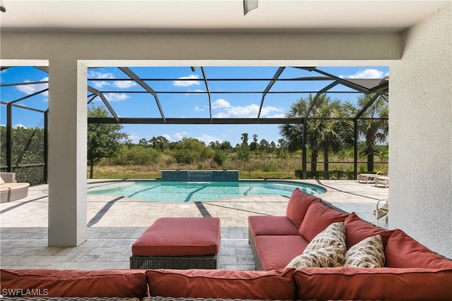 view of swimming pool featuring an outdoor living space, a patio, pool water feature, and a lanai