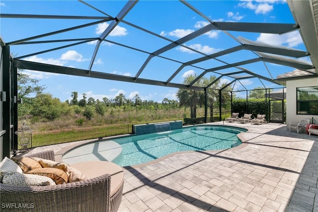 view of pool featuring pool water feature, a lanai, and a patio