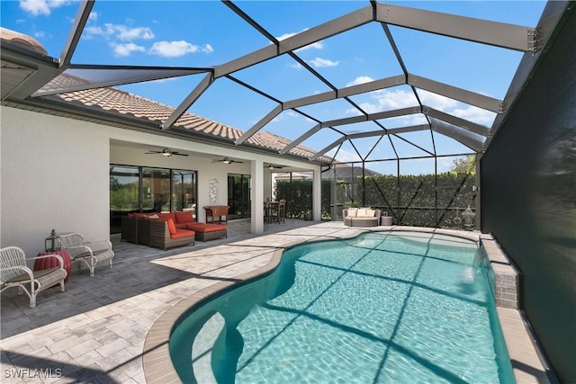 view of pool featuring outdoor lounge area, ceiling fan, pool water feature, and a patio