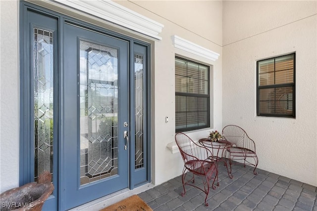 property entrance featuring covered porch