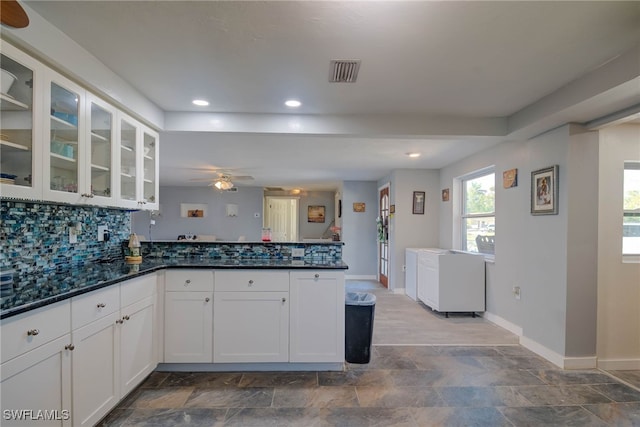 kitchen with white cabinets, decorative backsplash, kitchen peninsula, and ceiling fan