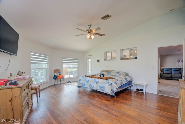 bedroom featuring ceiling fan, wood-type flooring, and lofted ceiling