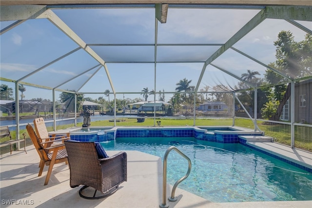 view of swimming pool featuring glass enclosure, an in ground hot tub, and a patio area