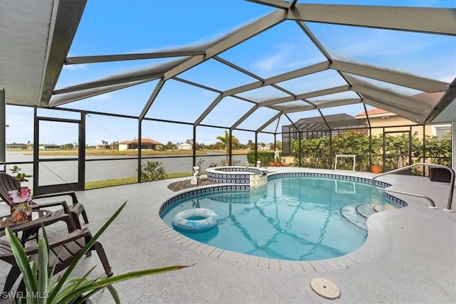 view of pool featuring glass enclosure, a patio area, and an in ground hot tub