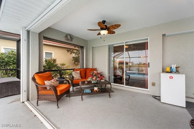 sunroom / solarium with ceiling fan