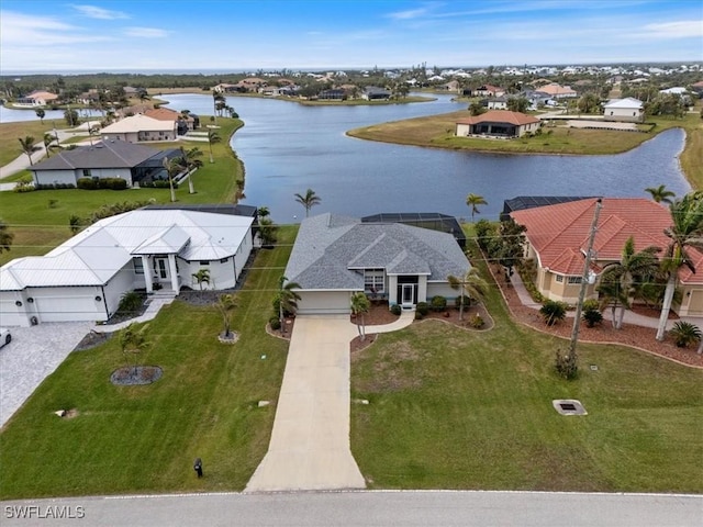 birds eye view of property with a water view