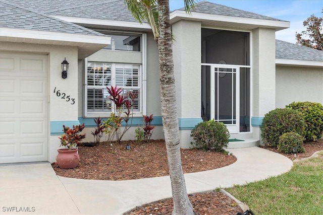 doorway to property featuring a garage