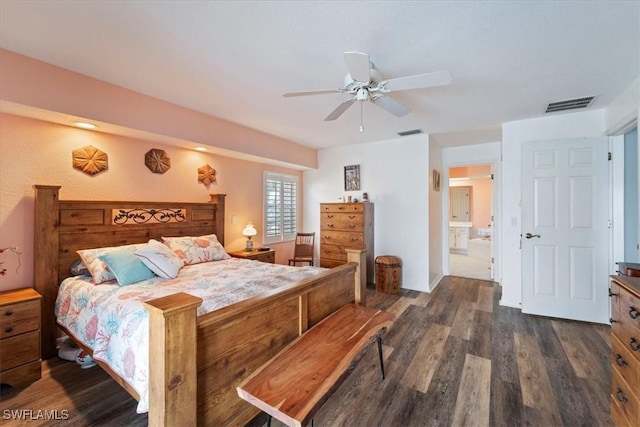 bedroom with dark hardwood / wood-style floors, ceiling fan, and ensuite bathroom