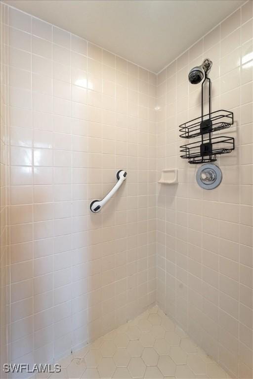 bathroom with tiled shower