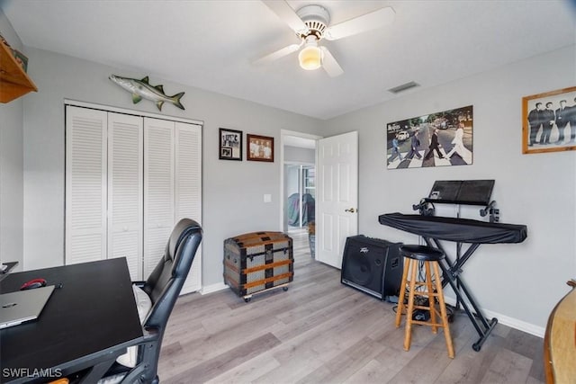 office space featuring ceiling fan and light hardwood / wood-style floors