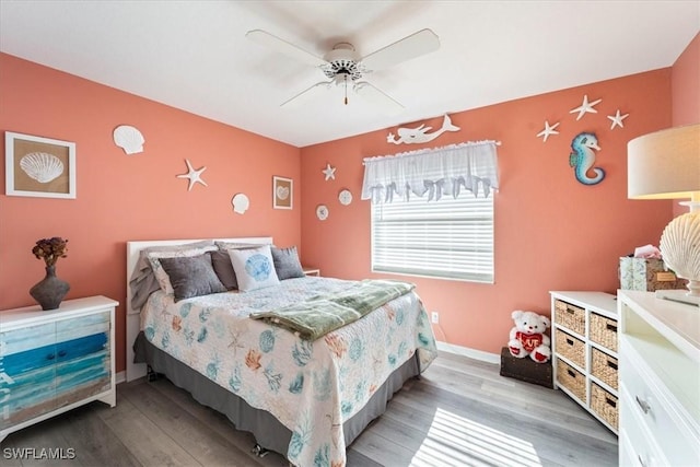 bedroom with hardwood / wood-style floors and ceiling fan