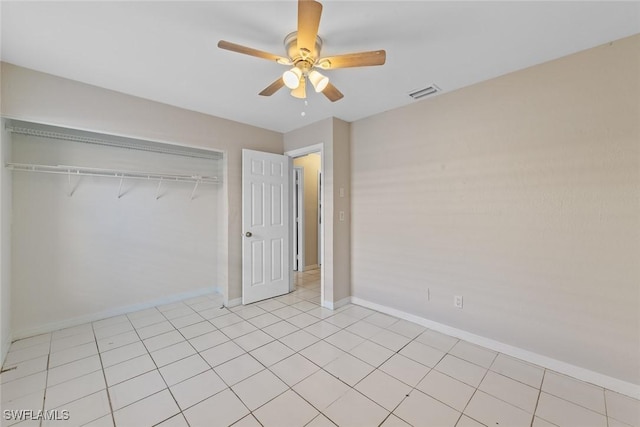 unfurnished bedroom with baseboards, visible vents, a closet, and ceiling fan