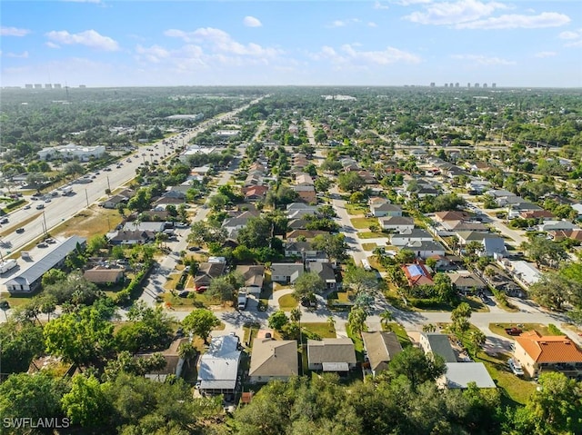 birds eye view of property with a residential view