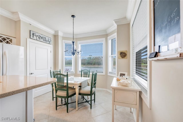 dining room with a chandelier, ornamental molding, and light tile patterned flooring