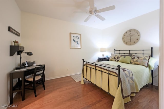 bedroom featuring ceiling fan and dark hardwood / wood-style flooring