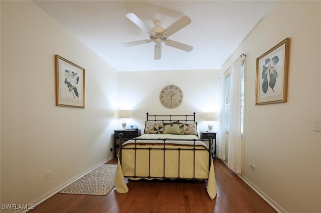 bedroom with ceiling fan and dark hardwood / wood-style floors