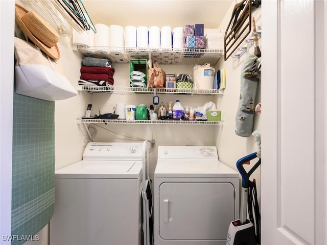 laundry room with independent washer and dryer