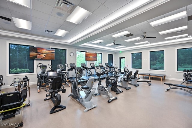 exercise room featuring a paneled ceiling and ceiling fan