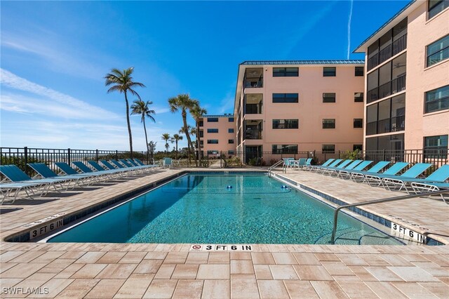 view of swimming pool with a patio