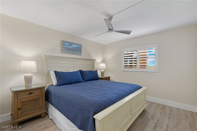 bedroom featuring ceiling fan and light hardwood / wood-style floors