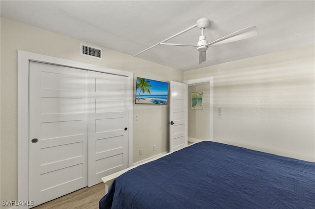 bedroom featuring ceiling fan and light wood-type flooring