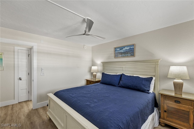 bedroom featuring ceiling fan and light wood-type flooring