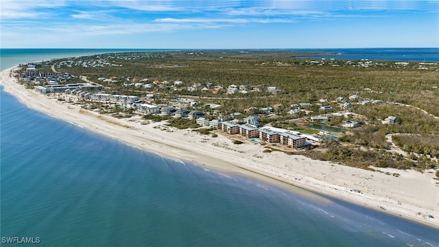 drone / aerial view with a water view and a beach view