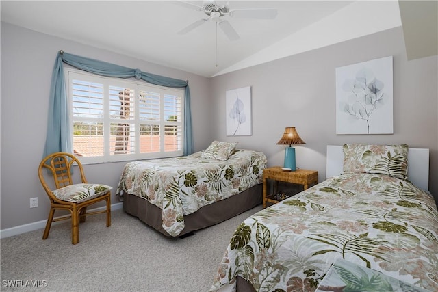 bedroom with vaulted ceiling, carpet, a ceiling fan, and baseboards