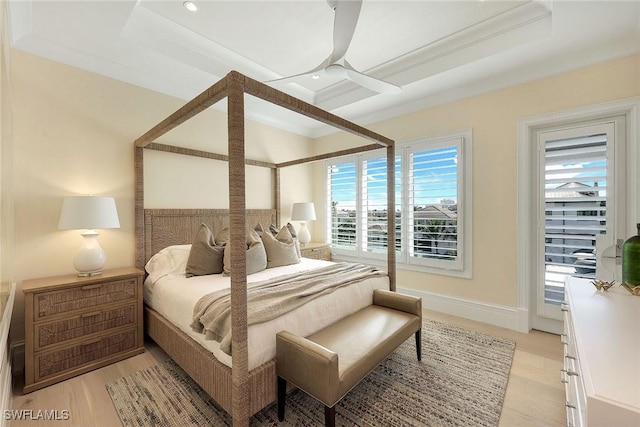 bedroom featuring light hardwood / wood-style flooring, ceiling fan, and ornamental molding