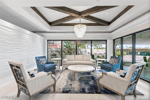 living room with beamed ceiling, a notable chandelier, coffered ceiling, and a wealth of natural light