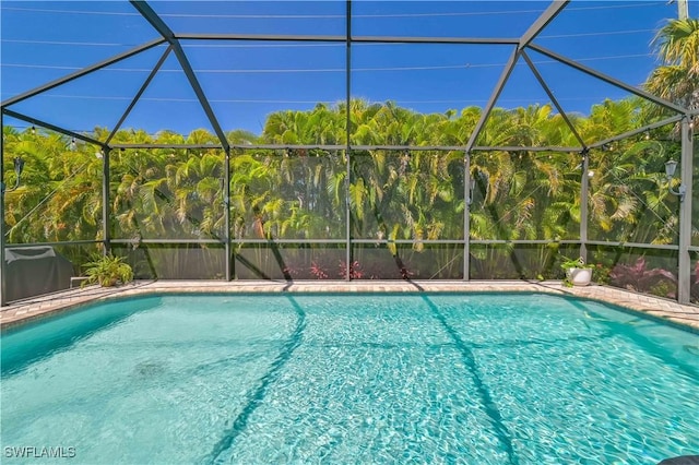 view of pool with a lanai