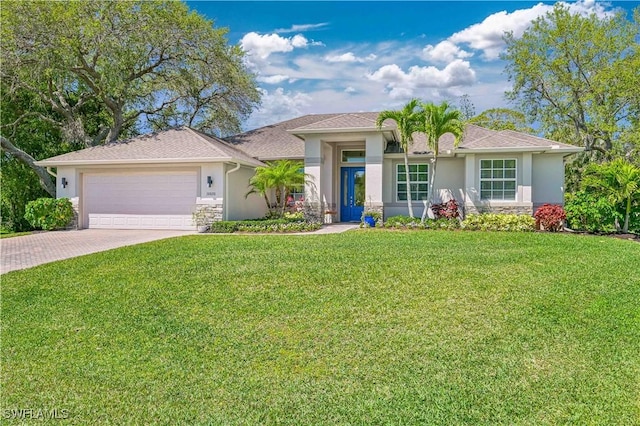 view of front of house with a garage and a front lawn