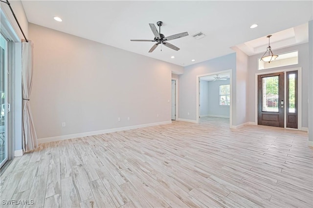 foyer entrance featuring ceiling fan and light hardwood / wood-style flooring