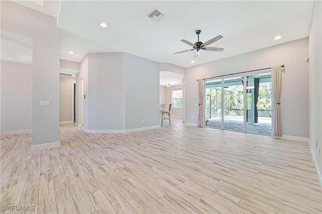 empty room featuring ceiling fan and light wood-type flooring