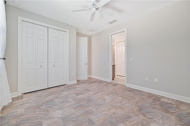 unfurnished bedroom with a closet and ceiling fan