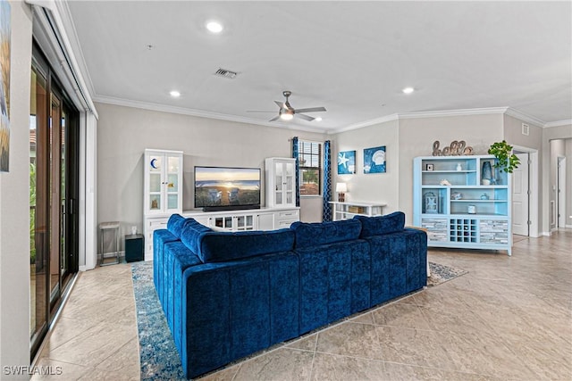 living room with ceiling fan and ornamental molding