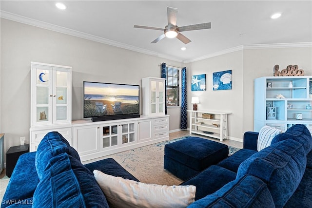 carpeted living room featuring ceiling fan and ornamental molding