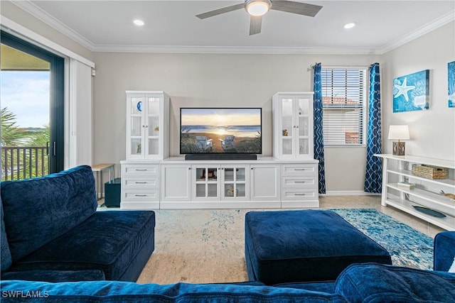 living room featuring ceiling fan and ornamental molding