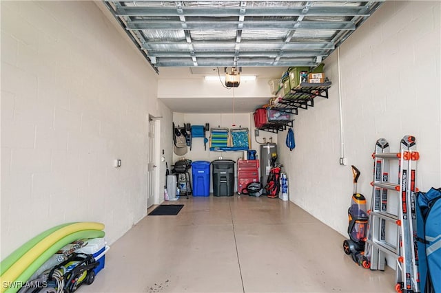 garage with a garage door opener and water heater