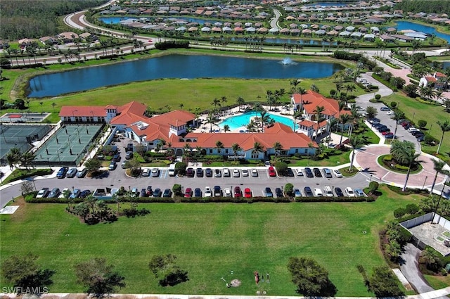 birds eye view of property with a water view